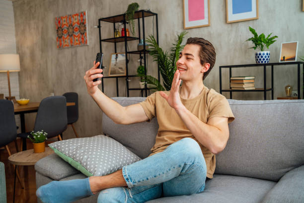 istock Man having a video call at home 2167531755