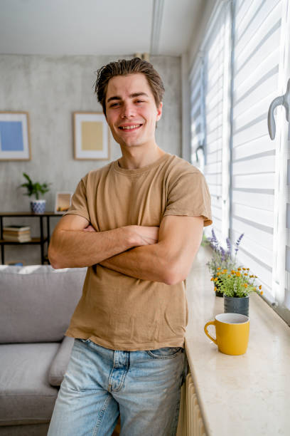 istock Young smiling man at home 2167532192