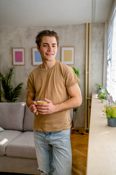 istock Man with coffee at home 2167532261