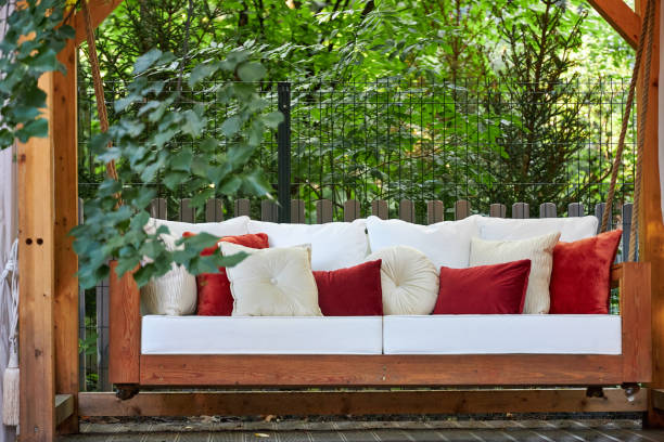 istock veranda with garden swing is decorated with fall decor and chrysanthemums 2167532348