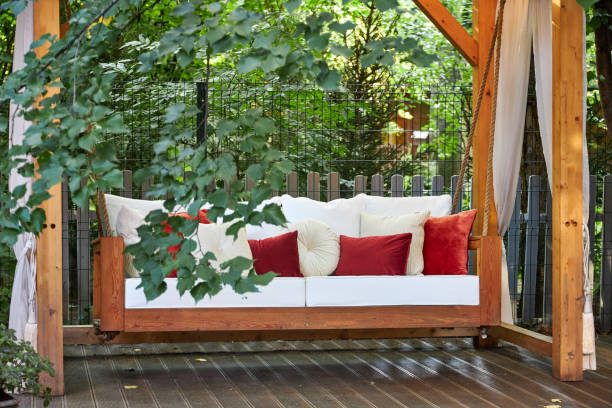 istock veranda with garden swing is decorated with fall decor and chrysanthemums 2167532349