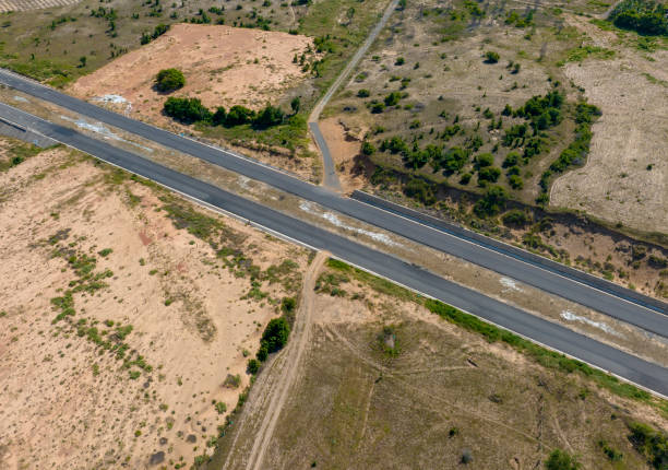 istock newly built asphalt road across the desert 2167533584