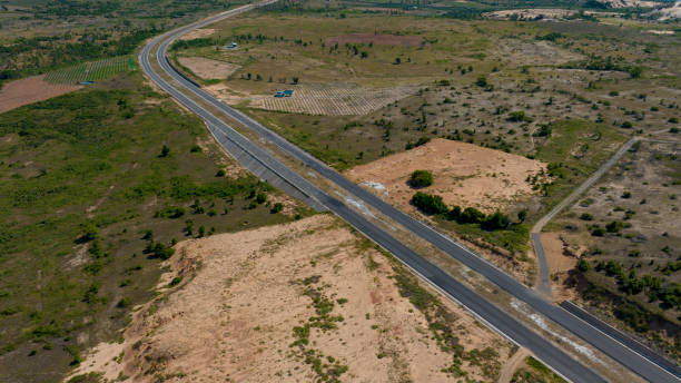 istock curved road by the sea 2167533598