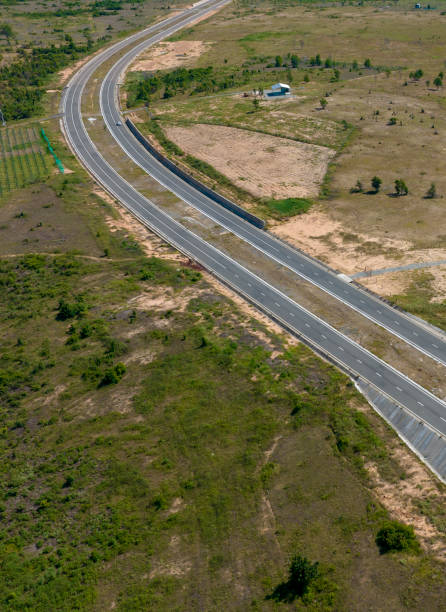 istock newly built asphalt road across the desert 2167533611