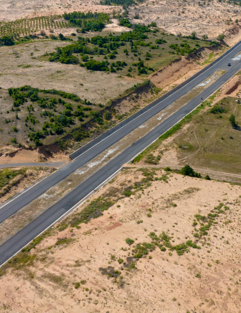 istock newly built asphalt road across the desert 2167533619