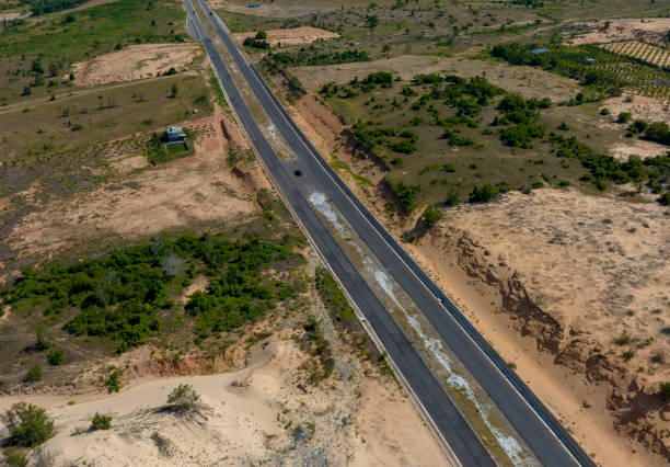 istock newly built asphalt road across the desert 2167533658