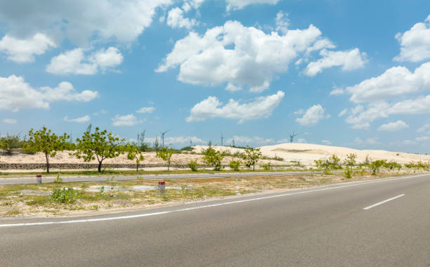 Two deserted parallel asphalt roads in Binh Thuan province, central Vietnam