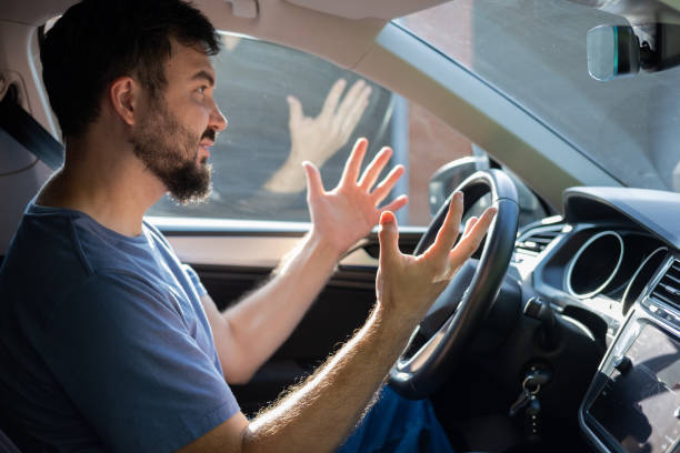istock Frustrated or stressed man driving car gesturing with hands. 2167535653