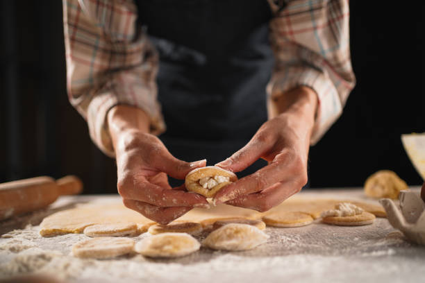 istock Female Hands Making Homemade Dumplings with Cottage Cheese, Preparation Process 2167536613
