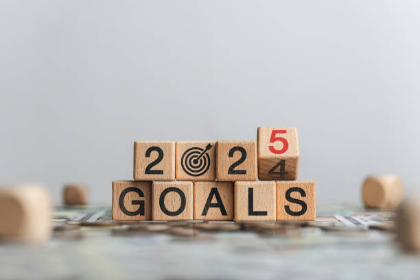 2025 Budget Planning and Allocation Concept. Wooden block that changes from 2024 budget to 2025 budget. Business growth, goals, planning, Happy New Year.