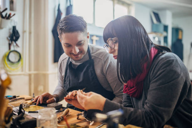 istock Man and woman working together in craft workshop 2167538610