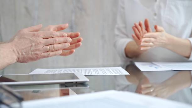 istock Unrecognizable business people clapping over glass table after contract signing in office. Agreement and handshake themes 2167539298