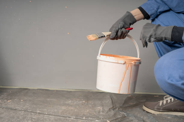 istock painter woman at work with a brush and bucket, close-up, bottom view 2167539873