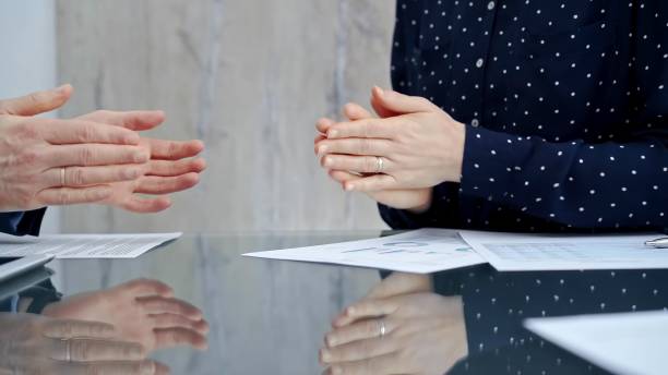 istock Unrecognizable business people shaking hands and clapping over glass table after contract signing in office. Agreement and handshake themes 2167545193