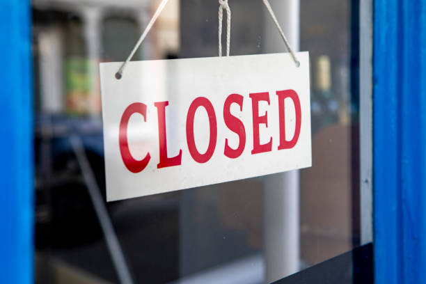 istock Closed sign in a shop window 2167545237