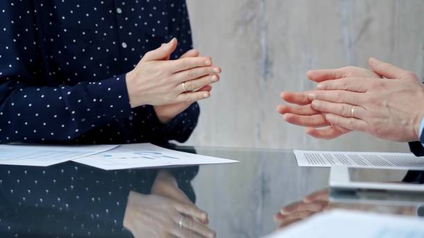 istock Unrecognizable business people shaking hands and clapping over g 2167546348