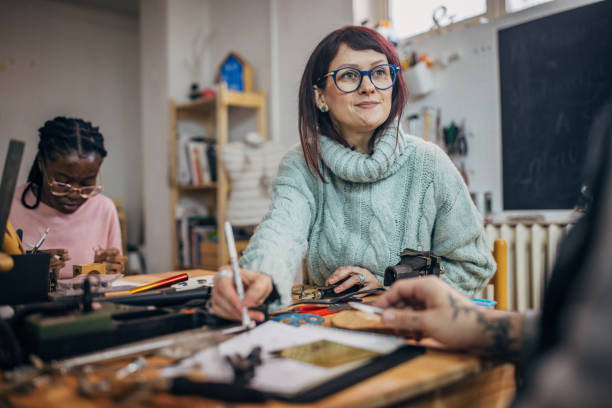istock Woman assisting with craft project at workshop table 2167547035