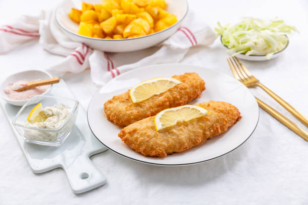 istock Crispy breaded fish with dipping sauce and lemon 2167547363