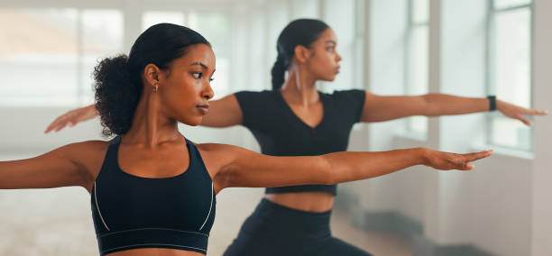 istock Calm ladies practicing yoga at the studio. 2167547447