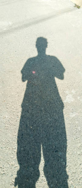 istock The shadow of a person during the day 2167548257