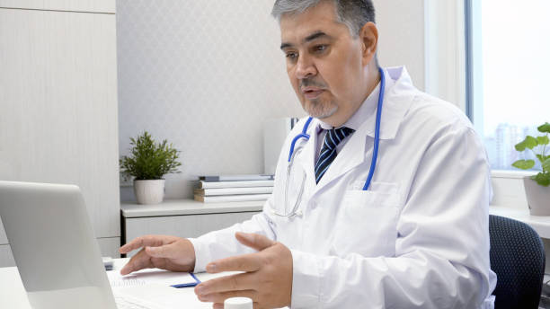 istock Male Doctor Working on Computer in Office 2167550320