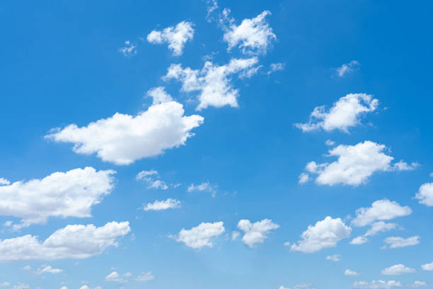 istock A bright, sunny day with fluffy white clouds in a blue sky 2167550882