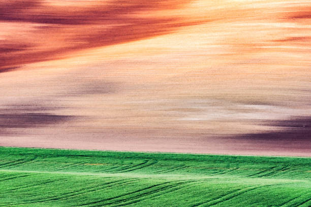 Abstract rural landscape with agricultural fields on spring hills. South Moravia region, Czech Republic