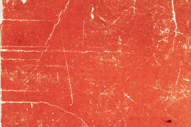 istock Aged, stained red paper, grungy, distressed red texture with white scratches and cracks 2167551884
