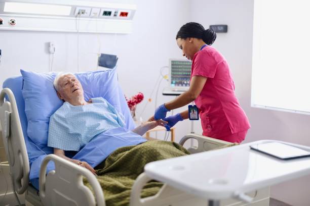 istock Nurse checking the pulse of her senior patient 2167555456