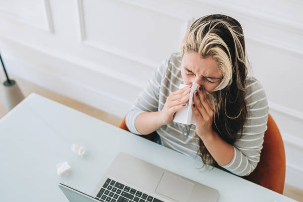 istock Woman with flu sneeze 2167556771