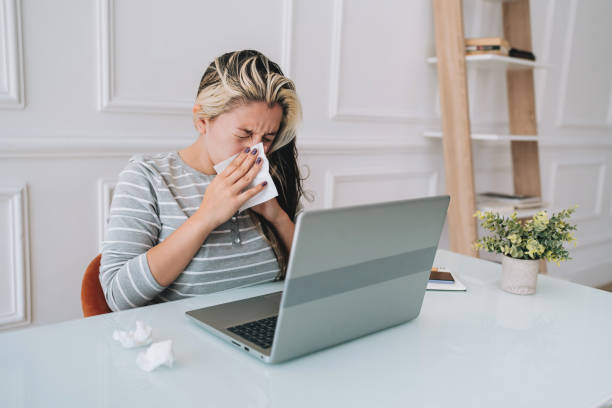 istock Woman with flu sneeze 2167556780