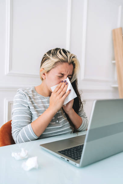 istock Woman with flu sneeze 2167556813
