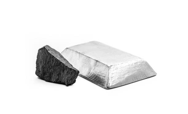 istock iron ore on isolated white background next to a polished steel i 2167562996