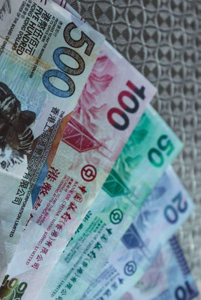istock Close-up of Hong Kong currency notes in various denominations displayed on a textured background 2167565048