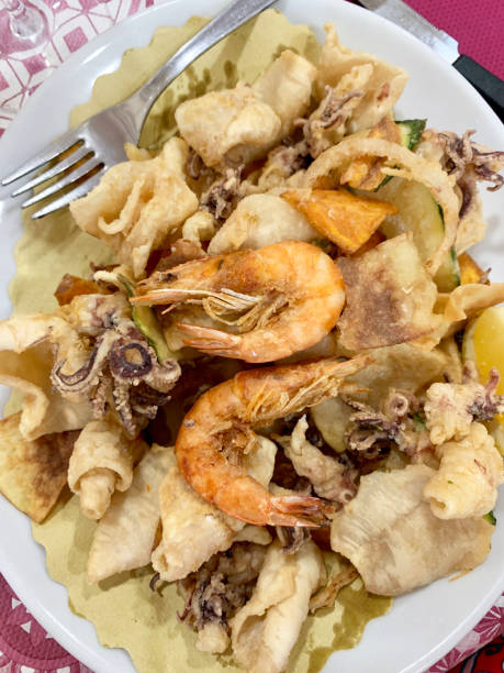 istock Fried prawns, calamari and vegetables. 2167565478