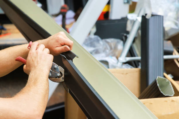 istock Aluminum rain gutters have been bent by a machine tool then cut with shears to required size 2167565754