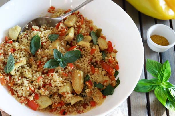 istock Cold chicken couscous with peppers and curry. 2167565856