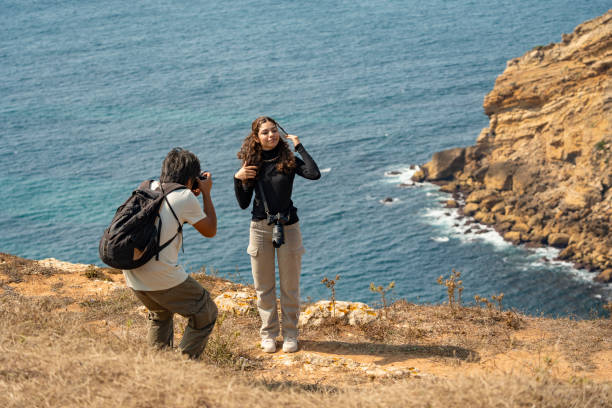 istock Photographer doing a photoshoot on a cliff 2167568023