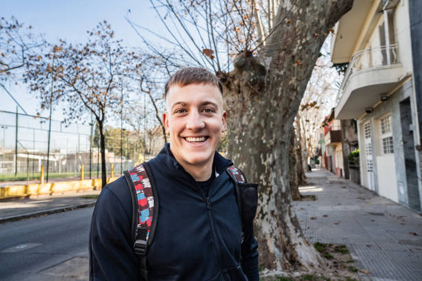 istock Portrait of a young man on the sidewalk 2167569780