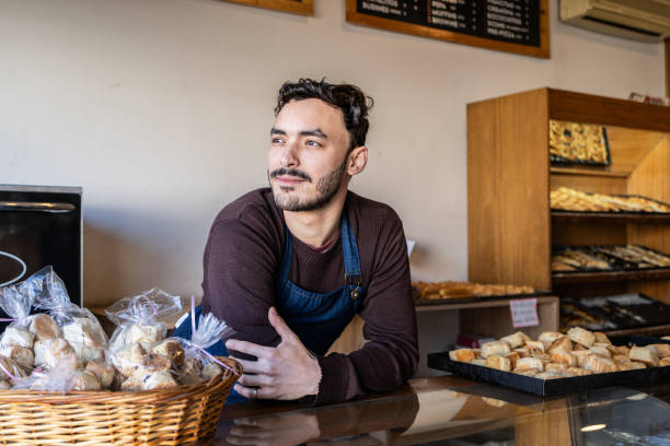 istock Young owner contemplating at bakery 2167569884