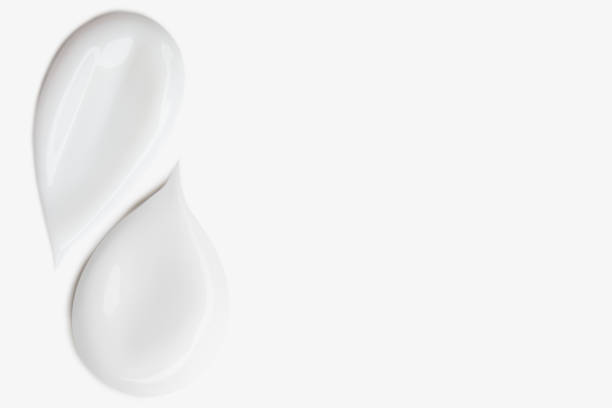 istock Smears of white cosmetic cream on a light background. 2167570023