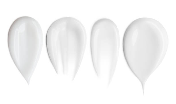 istock Set. Smears of white cosmetic cream on a blank background. 2167570030