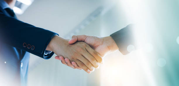 istock Trusted partner. Businessmen making handshake with partner, greeting, dealing, merger and acquisition, business cooperation concept, joint venture, Build trust in business and finance relationships. 2167570799