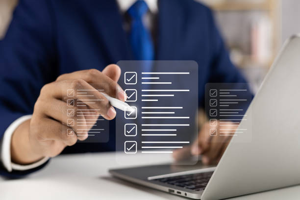 istock Digital Checklists for efficient business management, Businessman touching marking on checklist guide to paperless assessment and Future Success, Streamlining operations with online surveys. 2167571248