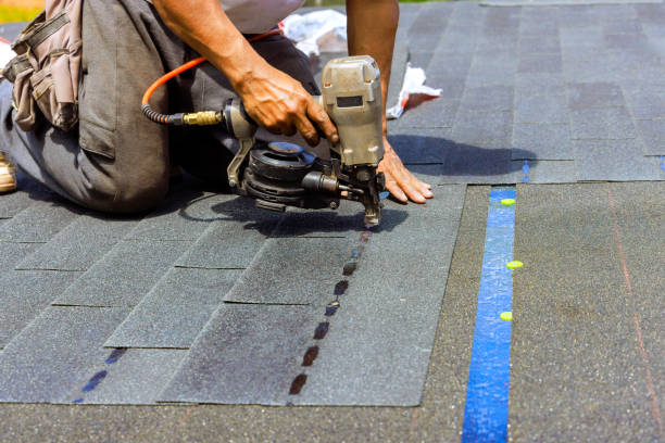 istock Construction worker used an air pneumatic nail gun when installing new bitumen shingles on a roof 2167571310