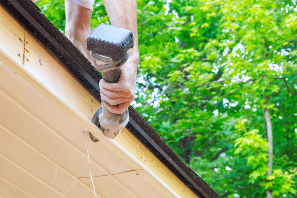 istock An employee cuts off existing vinyl soffit plastic panels to given size on a new home facade ceiling 2167571315