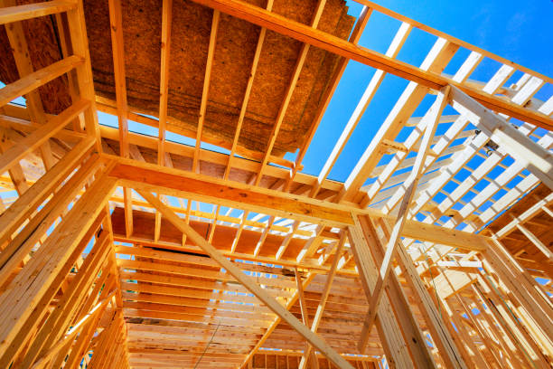 istock Framework for new home being constructed with wooden trusses, post a beams 2167571320