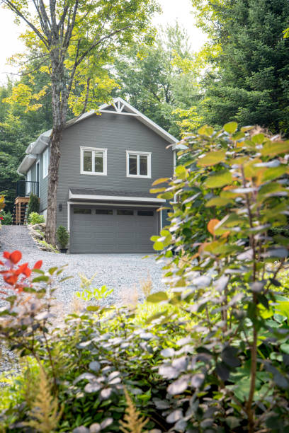istock Luxurious gray and white two-story detached double garage 2167571495