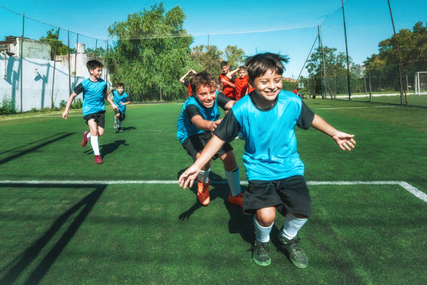 istock three soccer boys cheering after scoring a goal 2167573992