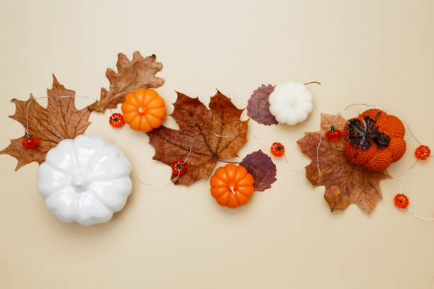 istock Autumn composition with maple leaves, decorative pumpkins and candles. Top view. Copy space 2167574633